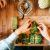 Women Making Vegetarian Savoy Cabbage Rolls For Christmas Dinner