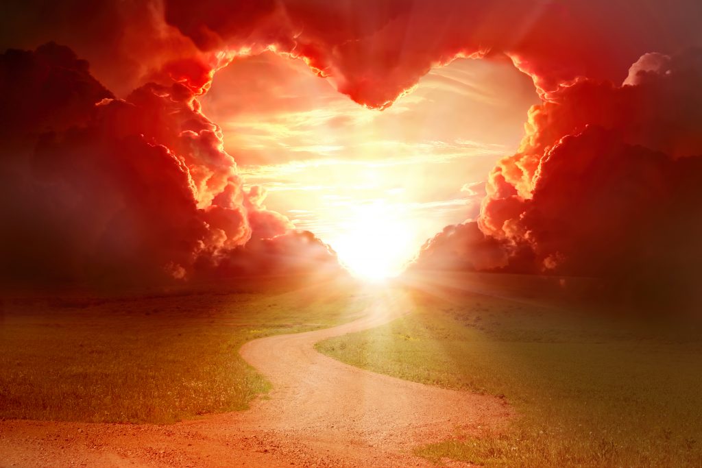 Red Heart Shaped Sky At Sunset. Beautiful Landscape With Flowers.love Background With Copy Space. Road To Love