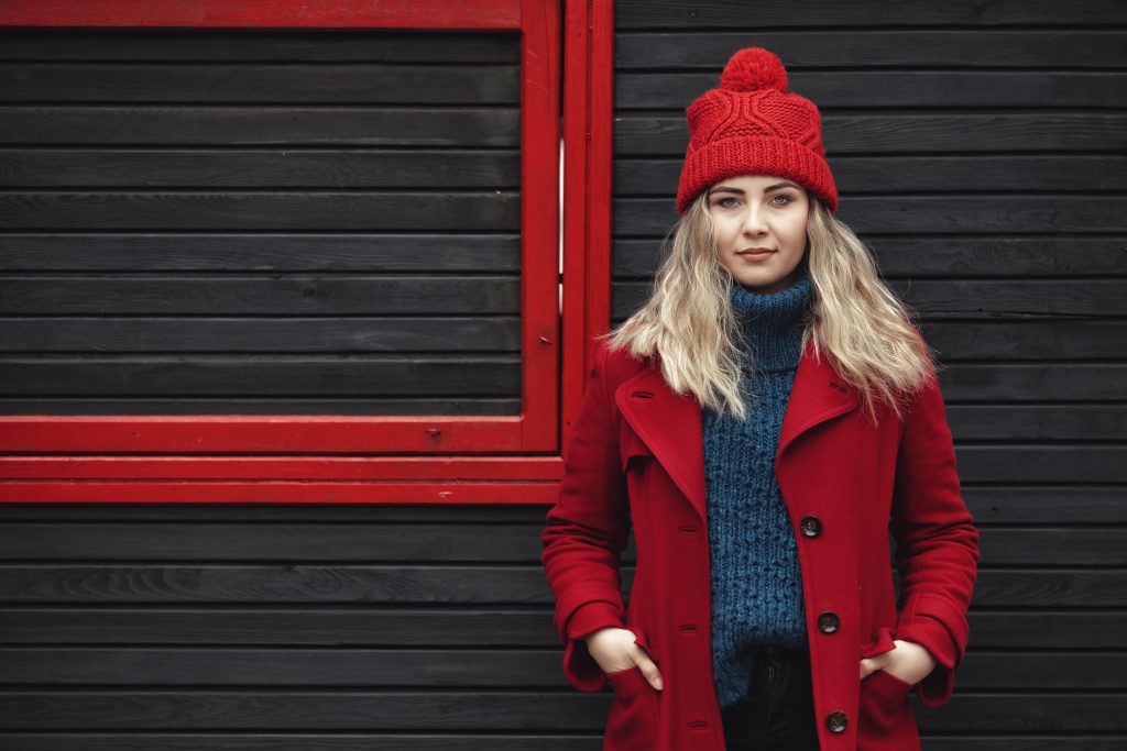 Portrait Of Abeautiful Woman Wearing Red Jacket In Winter