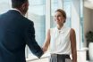 Handshake, Meeting And Business People Partnership For B2b Collaboration, Onboarding Welcome Or Professional Opportunity. Corporate Woman Or Clients Shake Hands For Deal In Office Building Interview