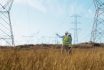 Teamwork, Electrical Engineer And Inspection In Power Station With People For Electricity Transmission And Tower Check. Engineering, Back And Collaboration For Energy Distribution Or Mockup In Field