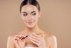 Portrait Of Beautiful Woman With Nailfile