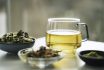 A Cup Of Tea With Dry Fruit, Flowers, And Herbs.