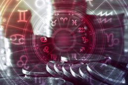 Astrology, Horoscope And Business Concept. Close Up Of Coins To Stack With Signs Of Zodiac Over Dark Background.