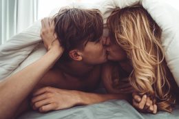 Couple Kissing In The Bedroom