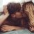 Couple Kissing In The Bedroom