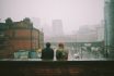 U1637156832 Two People Sitting Looking Out Over A Rainy City 1c22ce9d 4d73 4cde 9364 Df65c144e2ac 0