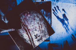 Bloody X Rays Hanging On A Rope In A Dark Room. Terrible Room Doctor Maniac Or Killer.