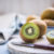 Kiwi Halves On Wooden Board