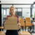 Happy Woman Holding Shipping Boxes In A Workplace 2026 01 07 00 21 38 Utc1